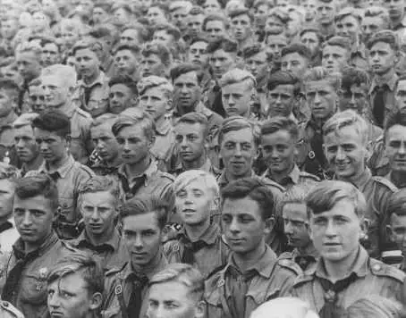 The Hitler Youth was an organization established by Adolf Hitler in 1933 to educate and train boys in Nazi principles. Led by Baldur von Schirach, who headed all German youth programs, the Hitler Youth had nearly 60 percent of German boys enrolled by 1935. On July 1, 1936, it was formalized as a state agency, making membership mandatory for all young "Aryan" Germans.